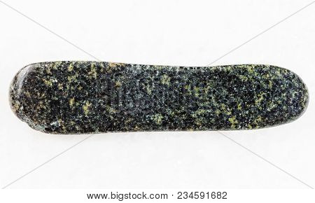 Macro Shooting Of Natural Mineral Rock Specimen - Polished Tholeiite Basalt Stone On White Marble Ba