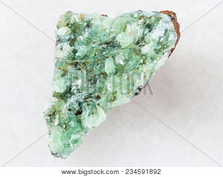 Macro Shooting Of Natural Mineral Rock Specimen - Rough Crystals Of Anapaite Gemstone On White Marbl