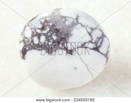 Macro Shooting Of Natural Mineral Rock Specimen - Polished Howlite Gemstone On White Marble Backgrou
