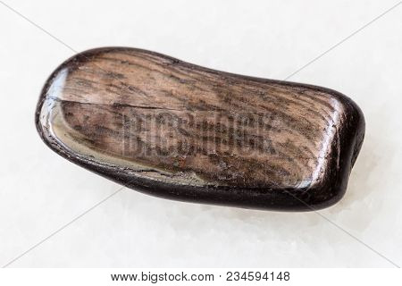 Macro Shooting Of Natural Mineral Rock Specimen - Polished Hypersthene Stone On White Marble Backgro