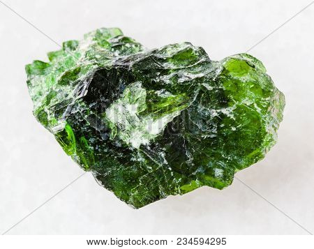 Macro Shooting Of Natural Mineral Rock Specimen - Rough Crystal Of Chrome Diopside Gemstone On White