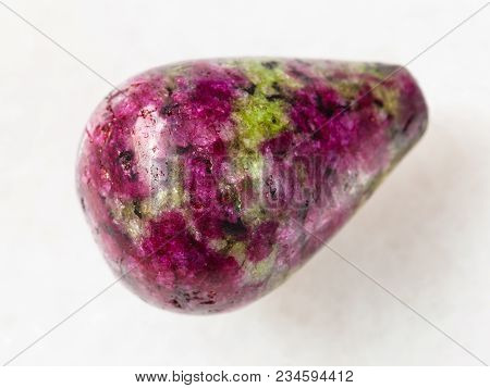 Macro Shooting Of Natural Mineral Rock Specimen - Polished Pink And Green Zoisite Gemstone On White 