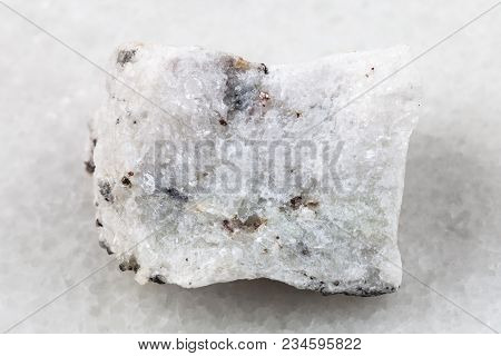 Macro Shooting Of Natural Mineral Rock Specimen - Raw Carbonatite Stone On White Marble Background