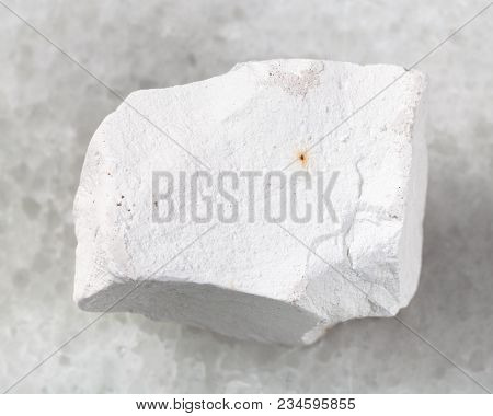 Macro Shooting Of Natural Mineral Rock Specimen - Raw Chalkstone On White Marble Background From Vor