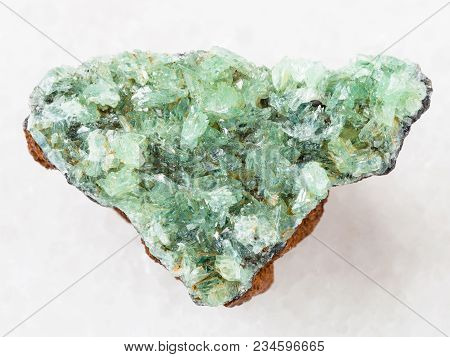 Macro Shooting Of Natural Mineral Rock Specimen - Raw Crystals Of Anapaite Gemstone On White Marble 