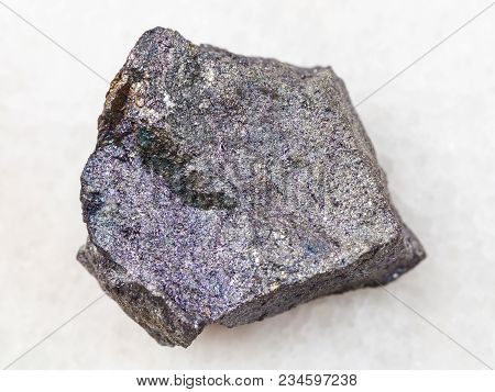 Macro Shooting Of Natural Mineral Rock Specimen - Raw Bornite Stone On White Marble Background From 