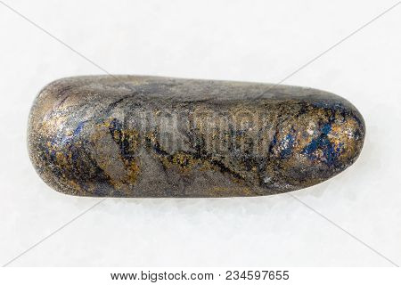 Macro Shooting Of Natural Mineral Rock Specimen - Polished Arsenopyrite Stone On White Marble Backgr
