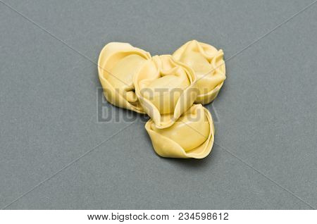 A Tortellino Pasta On A Gray Surface