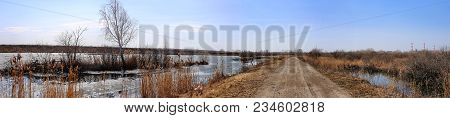 Rural Road And The Blue Sky. The Road Leaves Afar. Road In The Country. Panorama. Spring