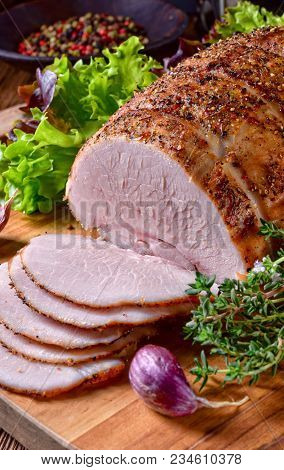 A Fresh Cooked Ham With Colorful Pfefer