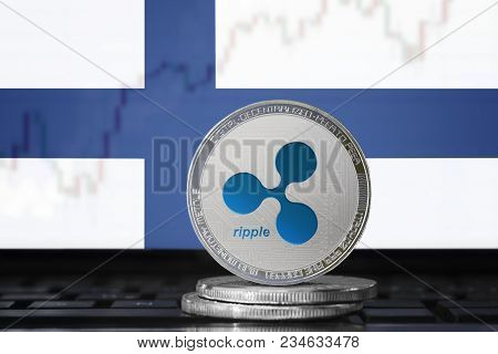 Ripple (xrp) Cryptocurrency; Physical Concept Ripple Coin On The Background Of The Flag Of Finland (