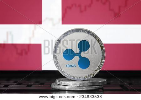 Ripple (xrp) Cryptocurrency; Physical Concept Ripple Coin On The Background Of The Flag Of Denmark (