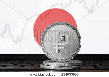 Petro (ptr) Cryptocurrency; Coin El Petro On The Background Of The Flag Of Japan; National Venezuela