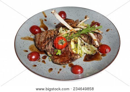 Fried Meat With Garnish Of Pepper, Zucchini, Tomato And Corn With Ajika Sauce Served On A Gray Plate