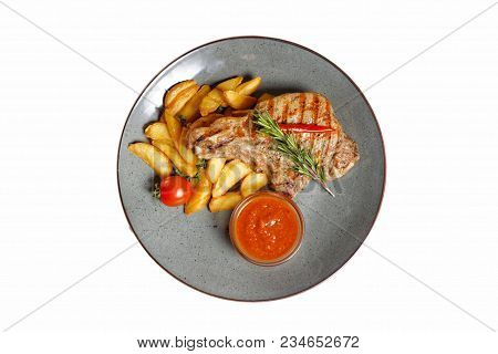 Fried Meat With Garnish Of Potatoes Isolated On White Background