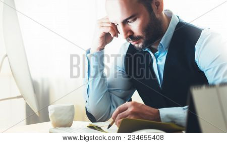 Bearded Young Businessman Working On Modern Office. Consultant Man Thinking Looking In Monitor Compu
