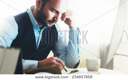 Bearded Young Businessman Working On Modern Office. Consultant Man Thinking Looking In Monitor Compu