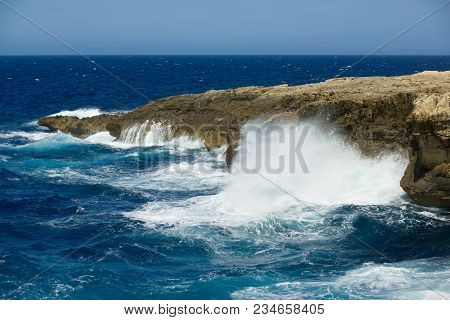 Wild Waves Of The Ocean Splash The Dry Shores Of Gozo, Malta