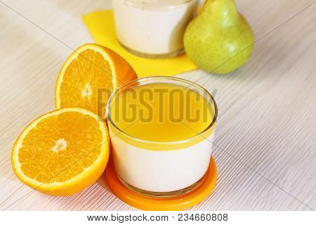 Food. Panna Cotta. Italian Milk Citrus Dessert Made Of Yoghurt And Cream With Pear And Orange.