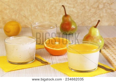 Food. Panna Cotta. Milk Fruit Dessert Made Of Yogurt And Cream With Pear, Lemon And Orange.
