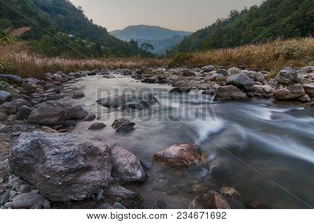 Beautiful Reshi River Water Flowing Through Stones And Rocks At Dawn, Sikkim, India. Reshi Is One Of