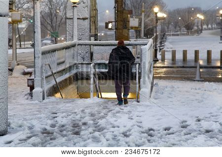 Bronx, New York - March 7: Woman Descend To Underground Subway Station At Yankee Stadium During Snow