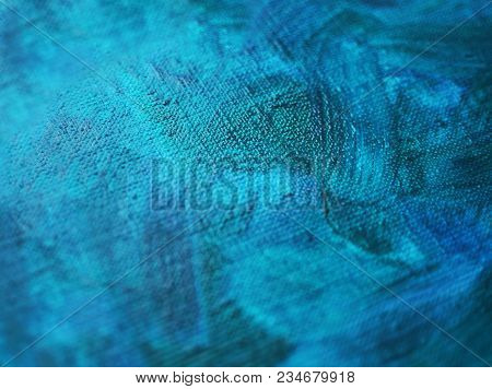 Texture Of A Canvas With Large Brushstokes Of Blue Oil Paint. Close-up, Selective Focus.