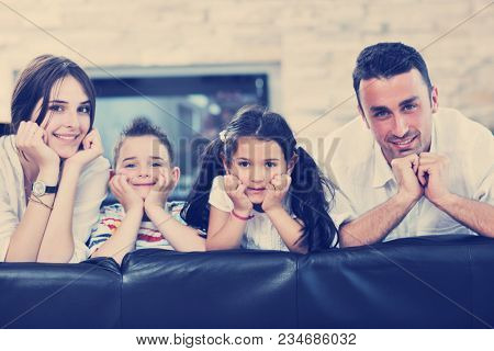 happy young family relax and have fun at modern home indooor