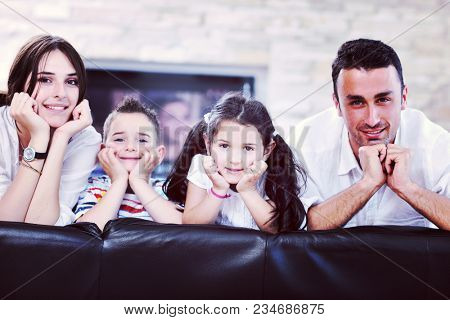 happy young family relax and have fun at modern home indooor