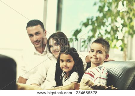 happy young family relax and have fun at modern home indooor