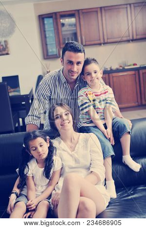 happy young family relax and have fun at modern home indooor