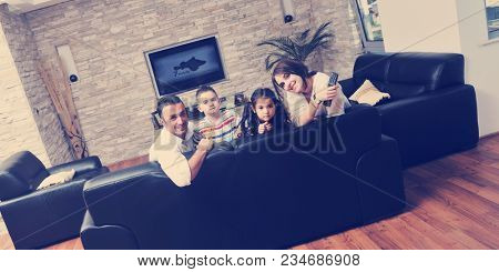 happy young family relax and have fun at modern home indooor
