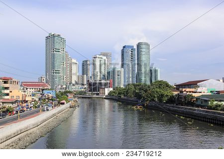 Manila - June 12: The Pasig River In Makati Passing  By High Rise Condo Buildings Of Rockwell Distrc