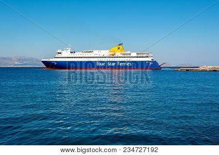 Naxos, Greece - May 23, 2017: Blue Star Ferry Boat Leaving The Port Of Naxos. Blue Star Ferries Is O