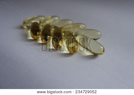 Group Of Capsules Of Fish Oil In A Shape Of Spike