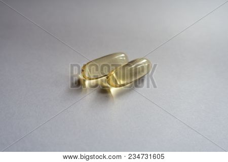 Close View Of Two Capsules Of Fish Oil