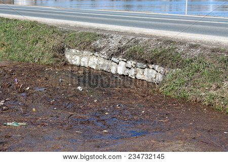 Flood Relief Channel Opening Under Local Road Fully Blocked From Floodwater Floating Garbage On Sunn