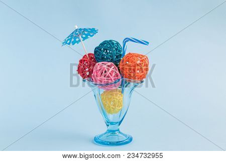 Sundae Ice Cream With Colorful Ice Cream Balls Made Of Rattan Balls, Paper Umbrella And Drinking Str