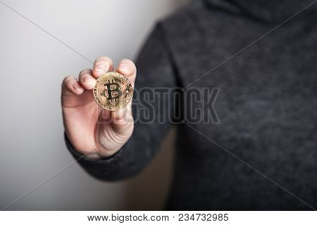 Golden Bitcoin In A Woman Hand, Digitall Symbol Of A New Virtual Currency. Woman Recived Money From 