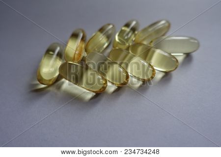 Close View Of Capsules Of Fish Oil In A Shape Of Spike