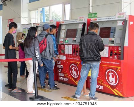 Jakarta, Indonesia - June 8, 2017: Some People On Queue Line In Front Of Ticket Vending Machine At P