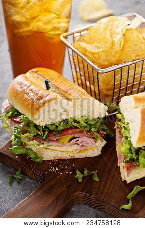 Italian Sub Sandwich With Salami, Ham And Chips