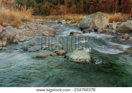 Beautiful Reshi River Water Flowing Through Stones And Rocks At Dawn, Sikkim, India. Reshi Is One Of