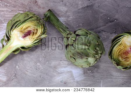 Artichokes On Grey Background. Fresh Organic Artichoke Flower.