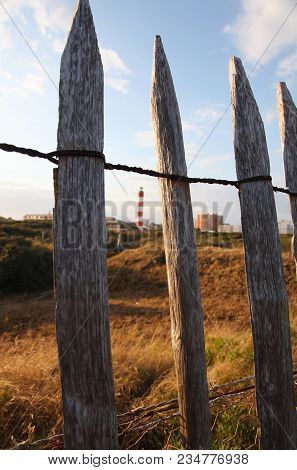 View Over The Fence At The Lighthouse In Berck In France