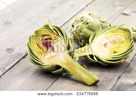 Artichokes On Grey Background. Fresh Organic Artichoke Flower.
