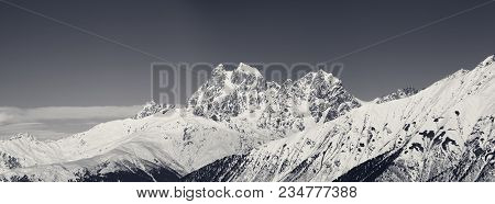 Panoramic View On Mount Ushba In Winter At Sunny Day. Caucasus Mountains. Svaneti Region Of Georgia.
