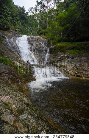 Lata Iskandar, Perak, Malaysia. March 25, 2018. A Lady Taking A Rest At A Lata Iskandar Waterfall, L