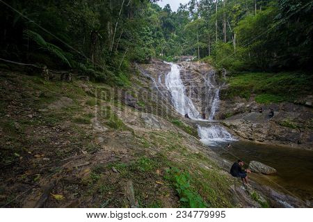 Lata Iskandar, Perak, Malaysia. March 25, 2018. A Lady Taking A Rest At A Lata Iskandar Waterfall, L