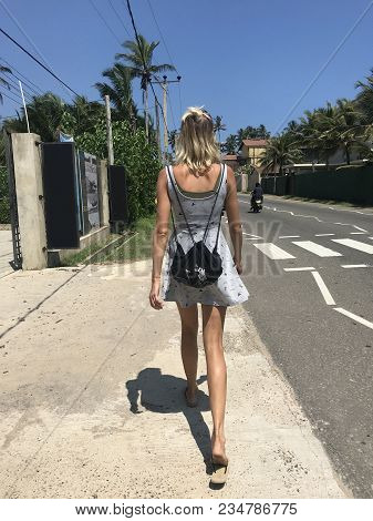 Woman Walking On The Street In A Tropical Country. Tourist.